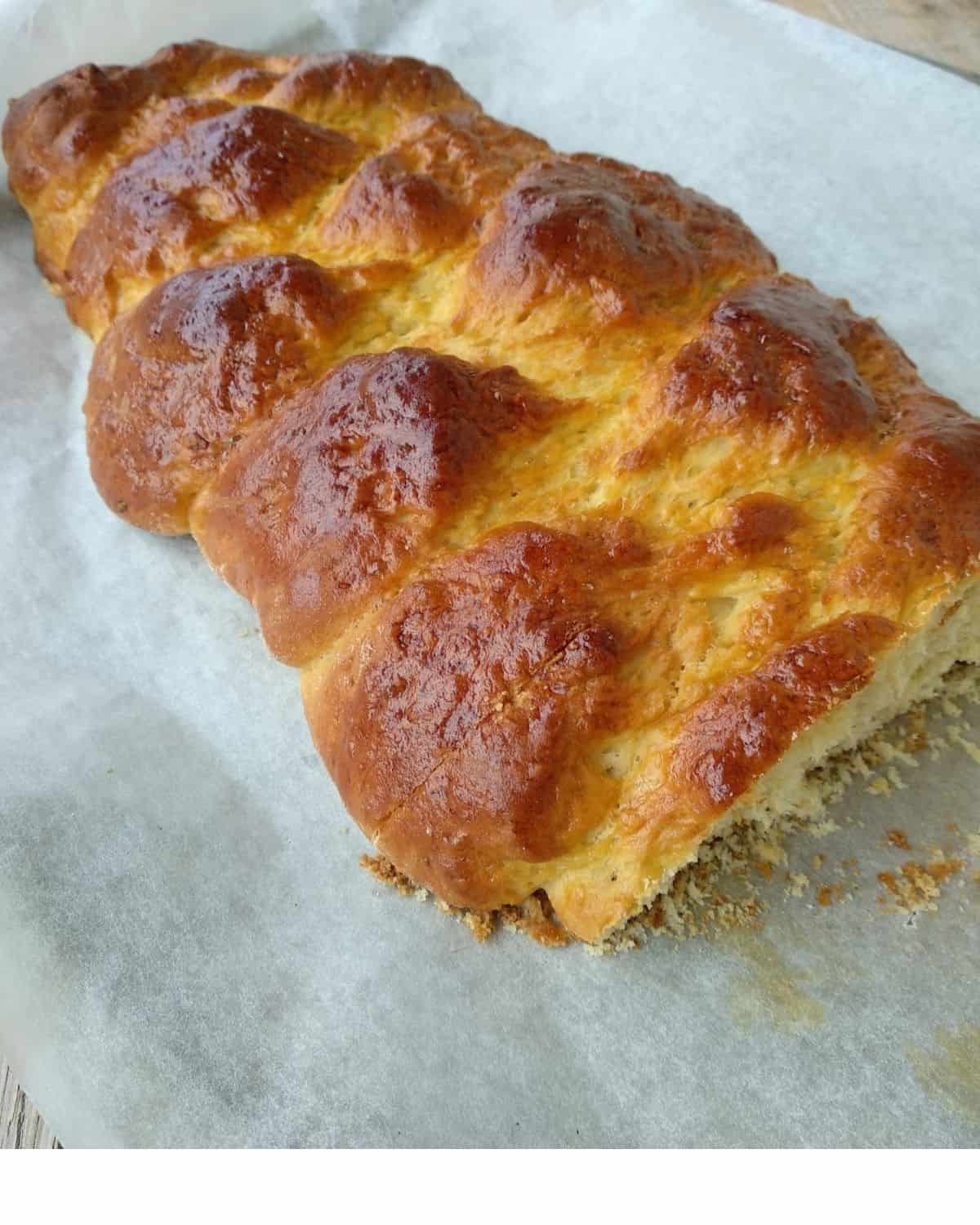 A close up from above of Braided Loaf Cake on parchment paper