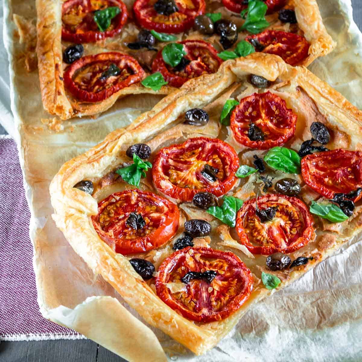 tomato tart on paper with forks