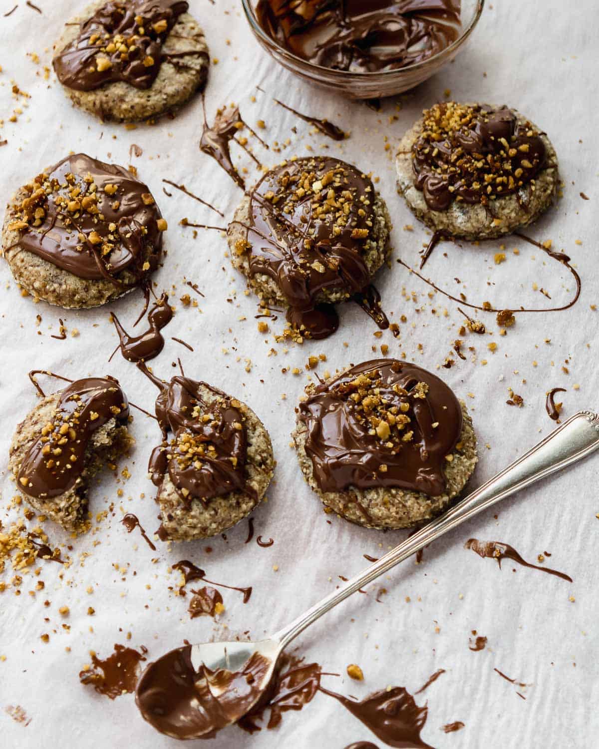 Nutella-Hazelnut-Cookies-one-bite-a-spoon-and-bowl-of-nutella