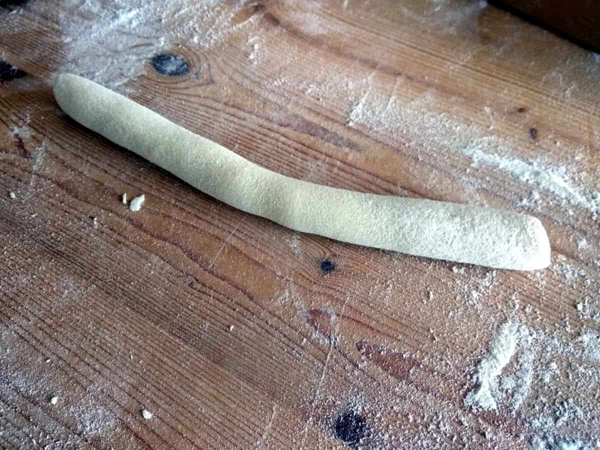 a piece of dough rolled into a sausage