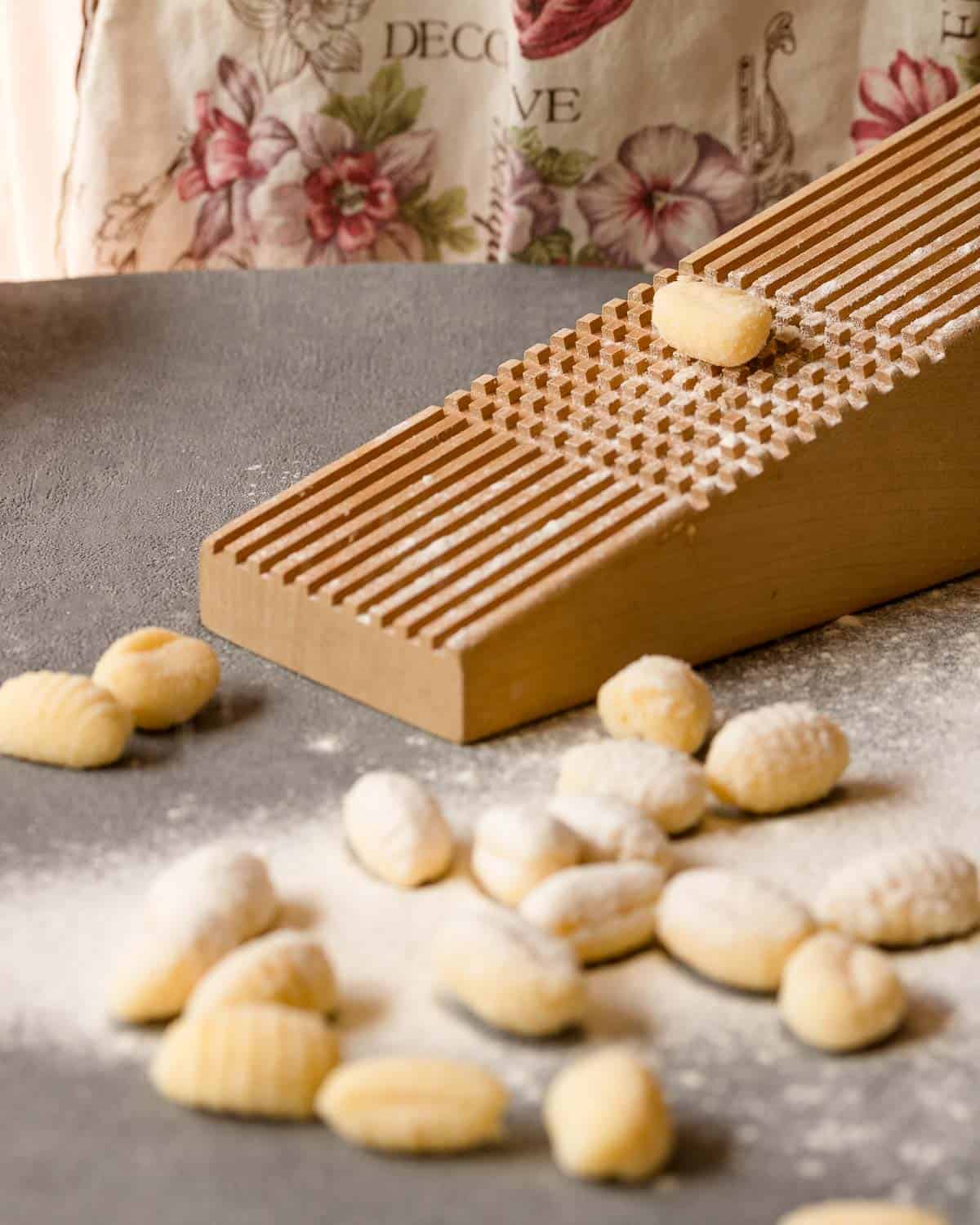 gnocchi on a grater and few gnocchi already rolled in front
