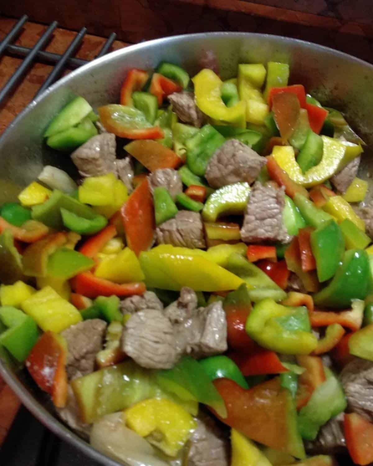 A pan with beef and cut peppers