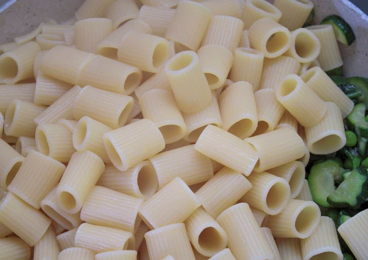 Toss cooked pasta with vegetables