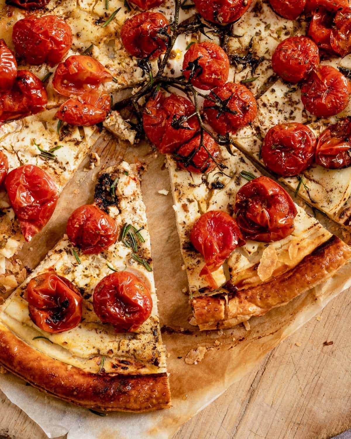 Close up from above of sliced cherry tomatoes tart
