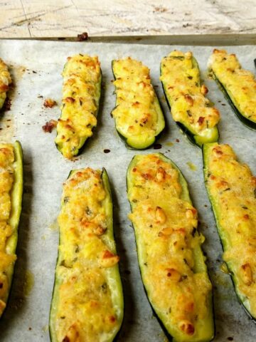 A view from above Stuffed Zucchini in a tray with parchment paper